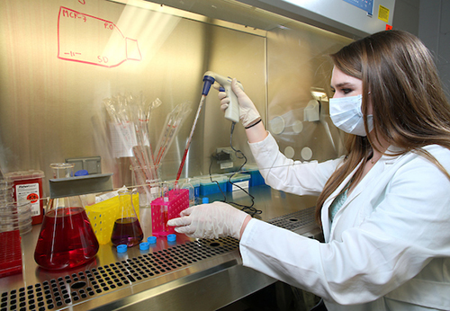 Female working in lab.