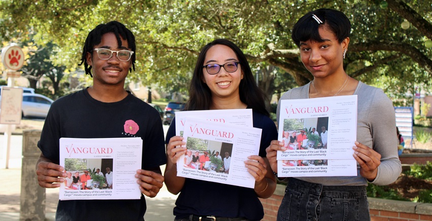 With print editions of The Vanguard student newspaper are, from left, Brandon Clark, managing editor; Stephanie Huynh, editor-in-chief; and Iman Thibodeaux, contributing writer.